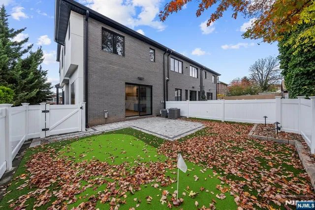 a front view of a house with parking space