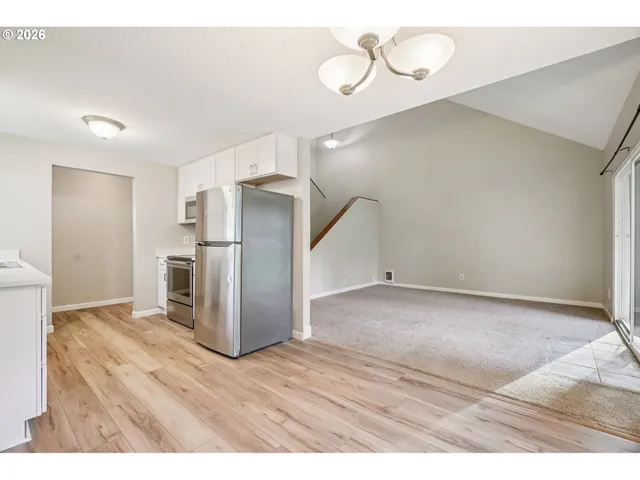 a view of a kitchen with a stove cabinets and wooden floor