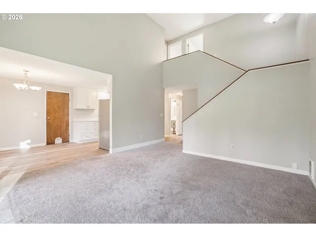 a view of an empty room with a windows