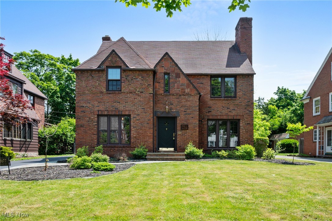 3677 Traver Road Shaker Heights, OH 44122 - Photo 1 of 35 Tudor home with a chimney, brick siding, and a front yard