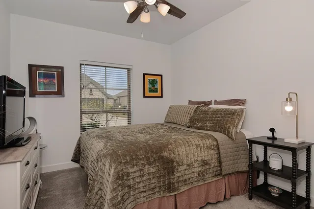 a view of a house with a backyard porch and sitting area