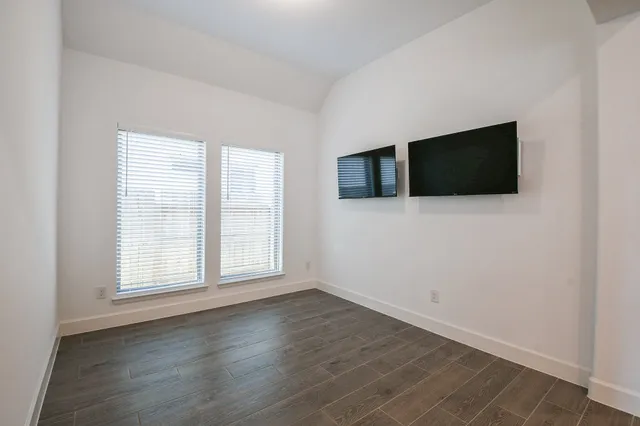 a view of a lake with houses in the back