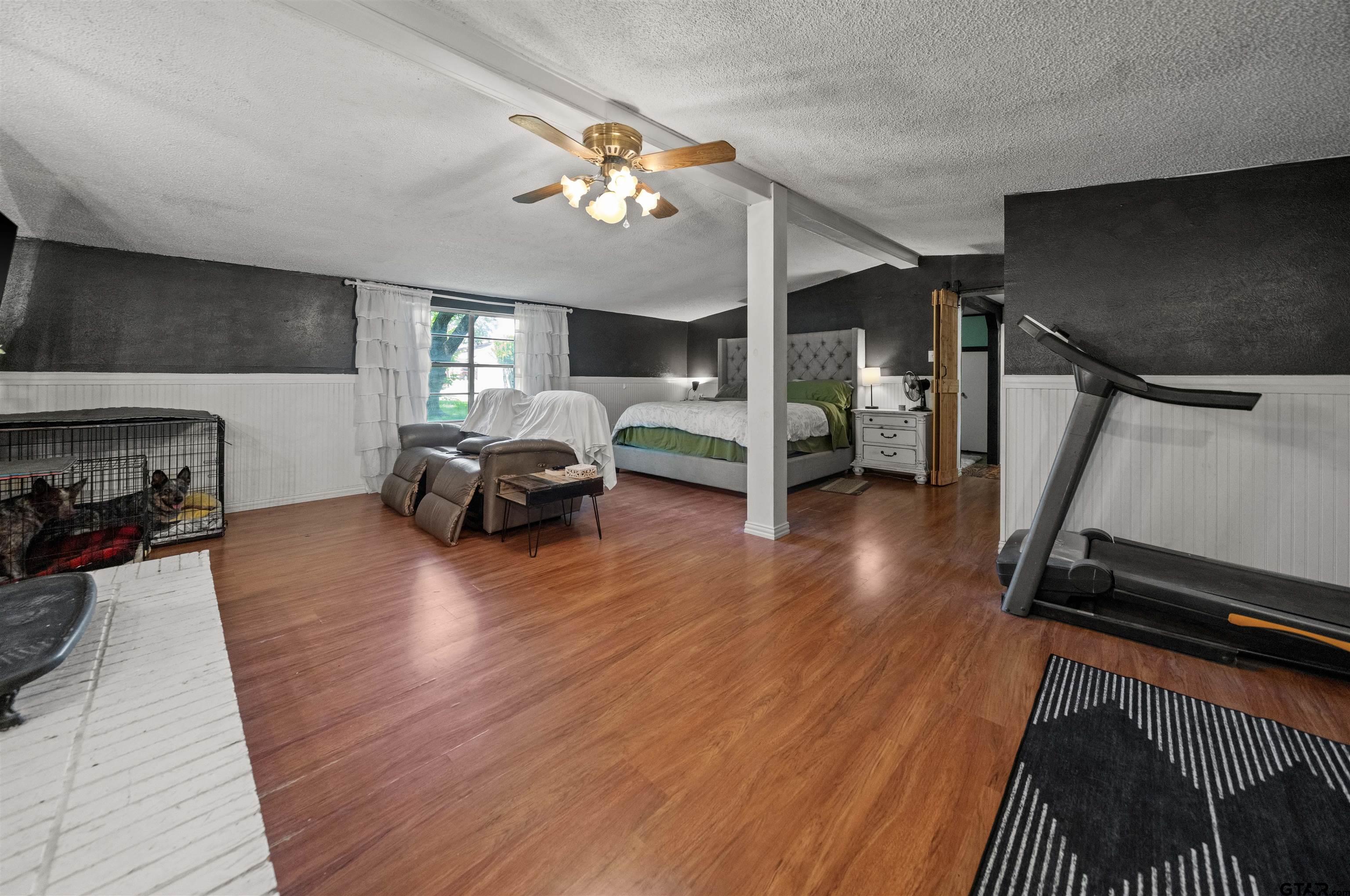 110 Utah Street Van, TX 75790 - Photo 18 of 48 a living room with furniture and a wooden floor