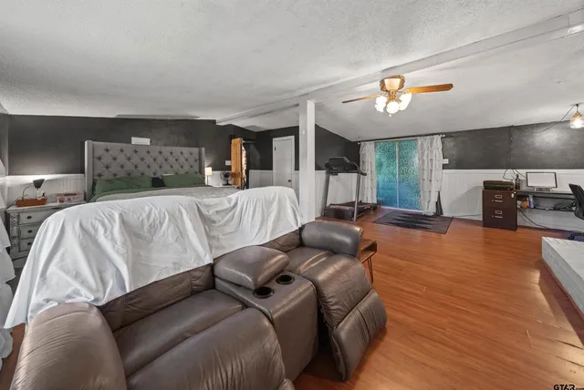 a bed room with a bed and a television