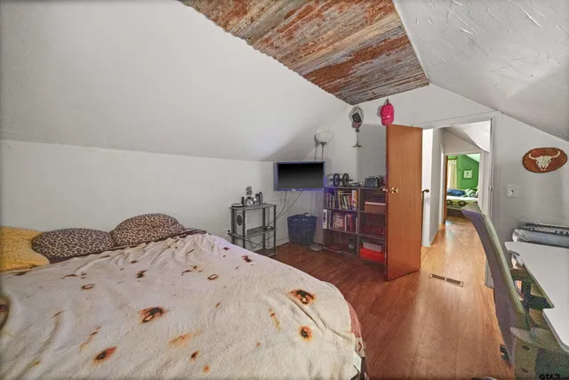 a view of a living room and kitchen