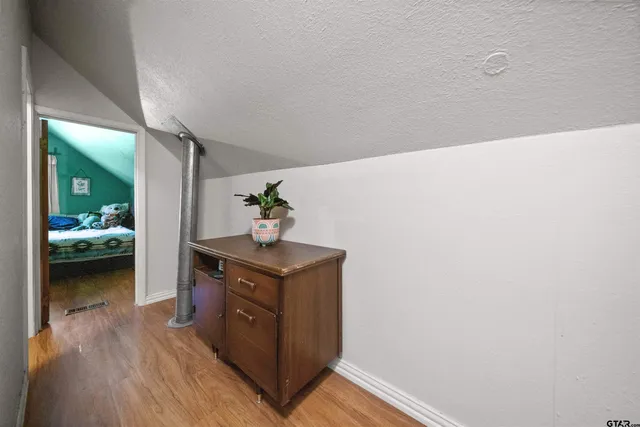 a hallway with a washer and dryer