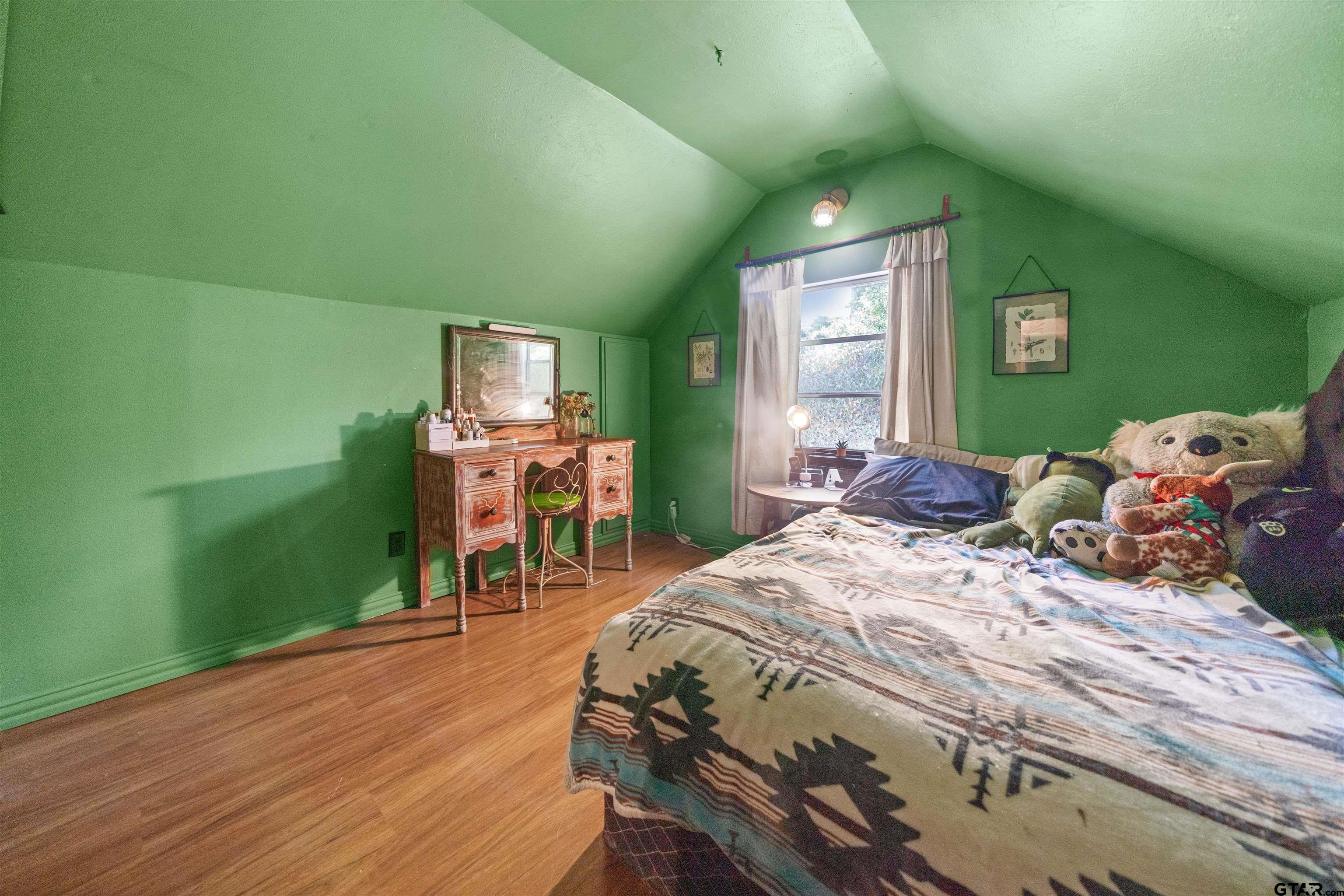 110 Utah Street Van, TX 75790 - Photo 29 of 48 a bedroom with a bed and a table in it