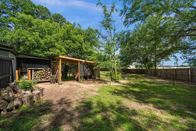 a backyard of a house with lots of green space