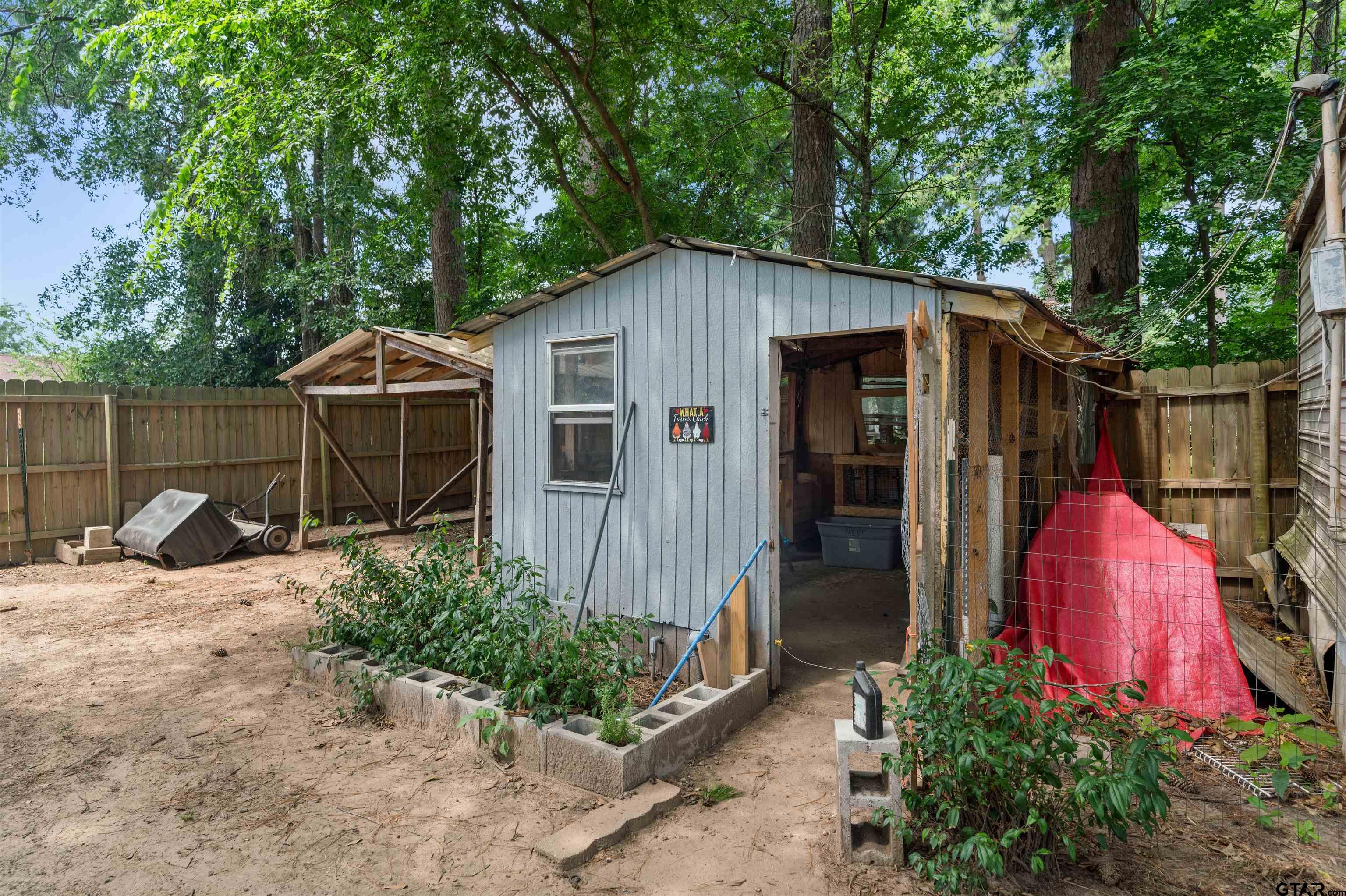 110 Utah Street Van, TX 75790 - Photo 46 of 48 a view of a house with backyard and sitting area