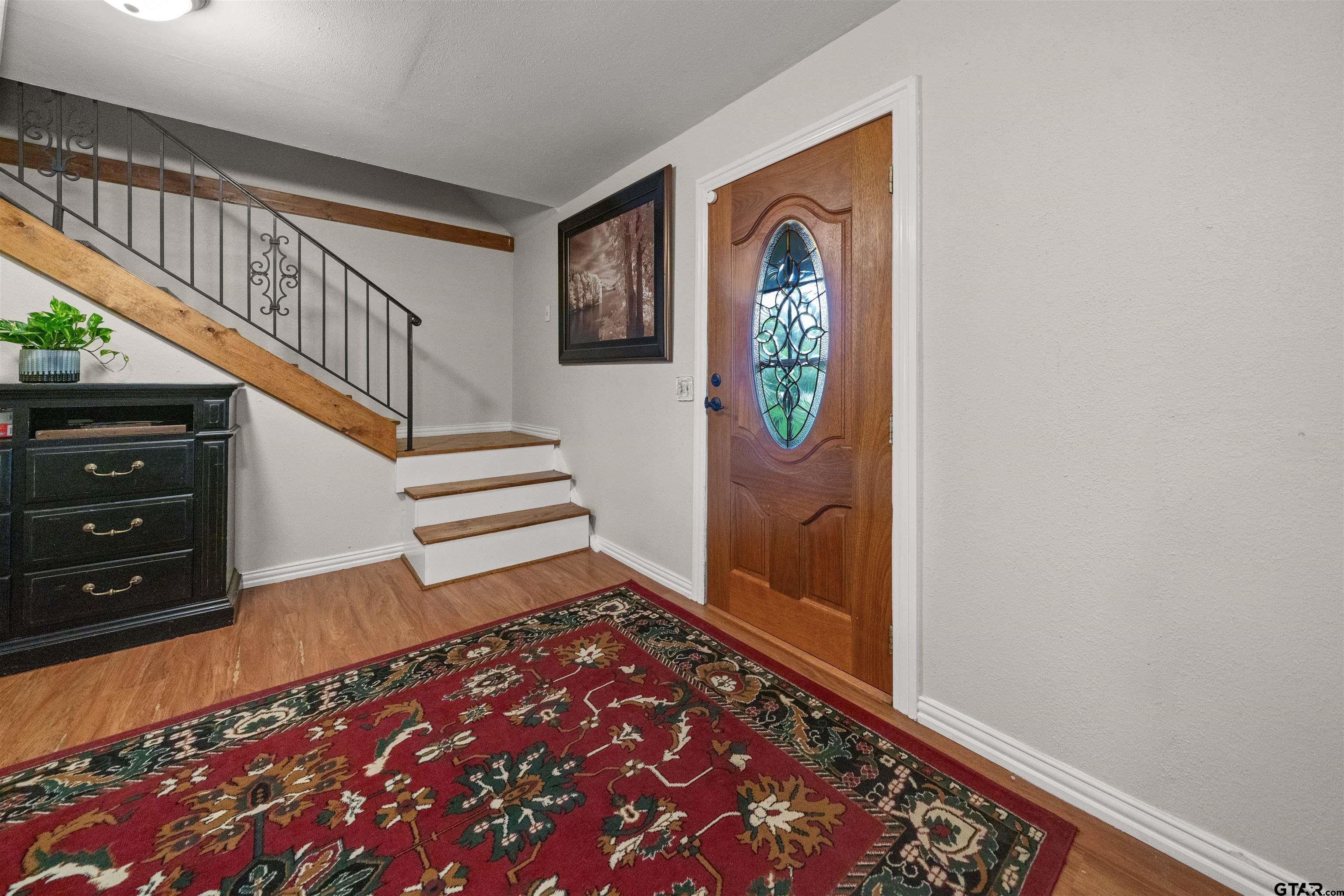 110 Utah Street Van, TX 75790 - Photo 5 of 48 a view of an entryway with wooden floor