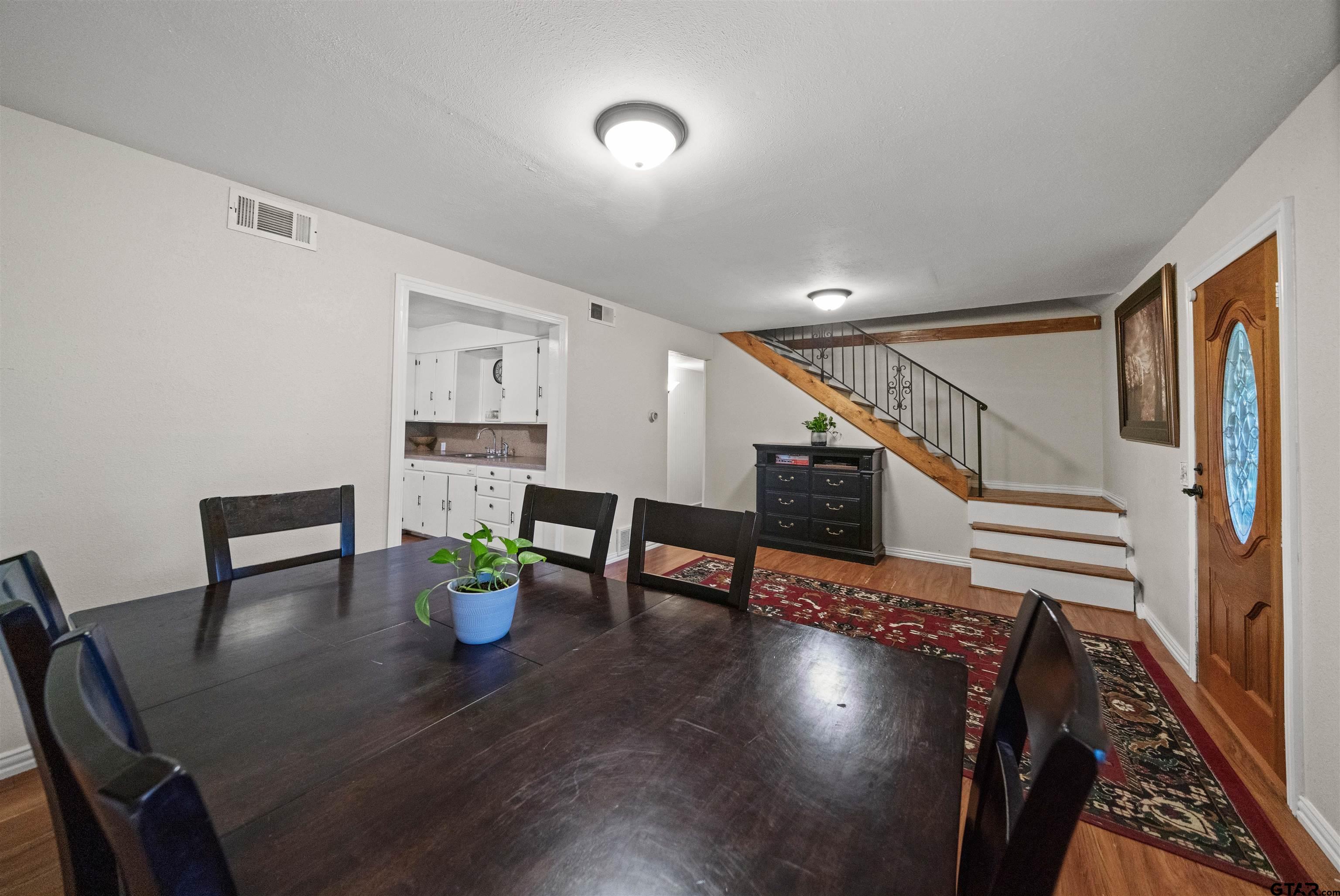 110 Utah Street Van, TX 75790 - Photo 8 of 48 a dining room with furniture and wooden floor