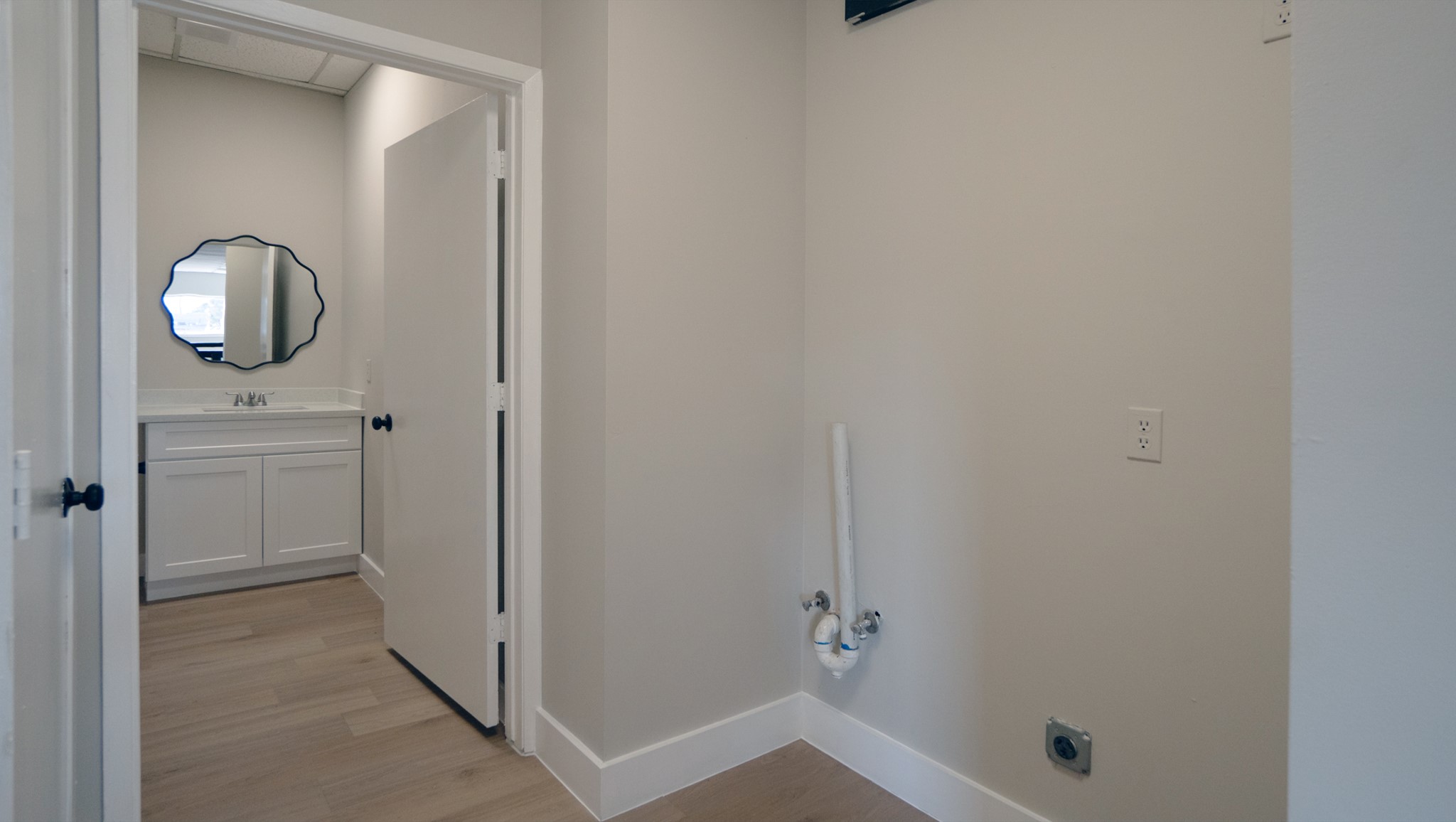 9220 Rasmus Drive Houston, TX 77063 - Photo 14 of 30 a bathroom with a sink and mirror with toilet