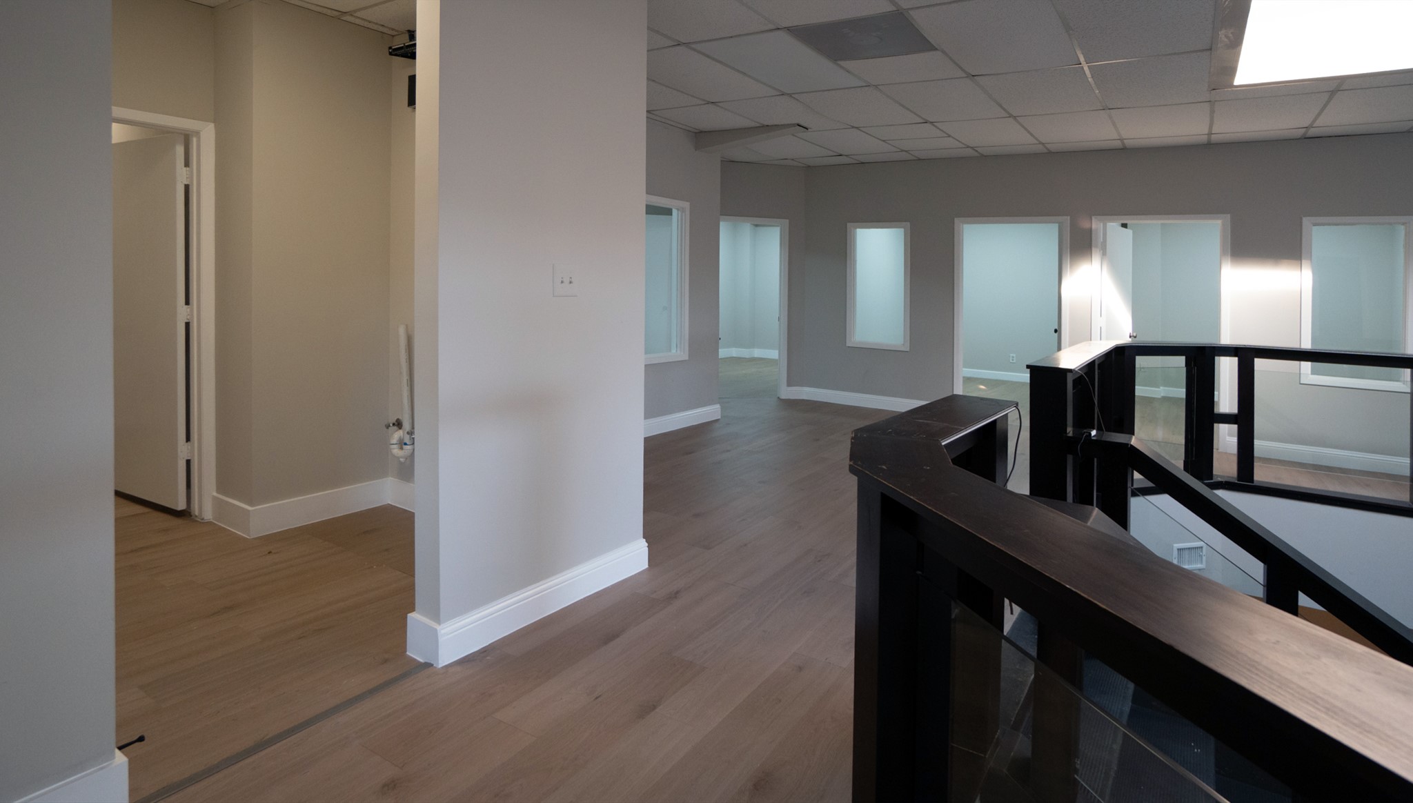 9220 Rasmus Drive Houston, TX 77063 - Photo 15 of 30 a view of a hallway with furniture and stairs