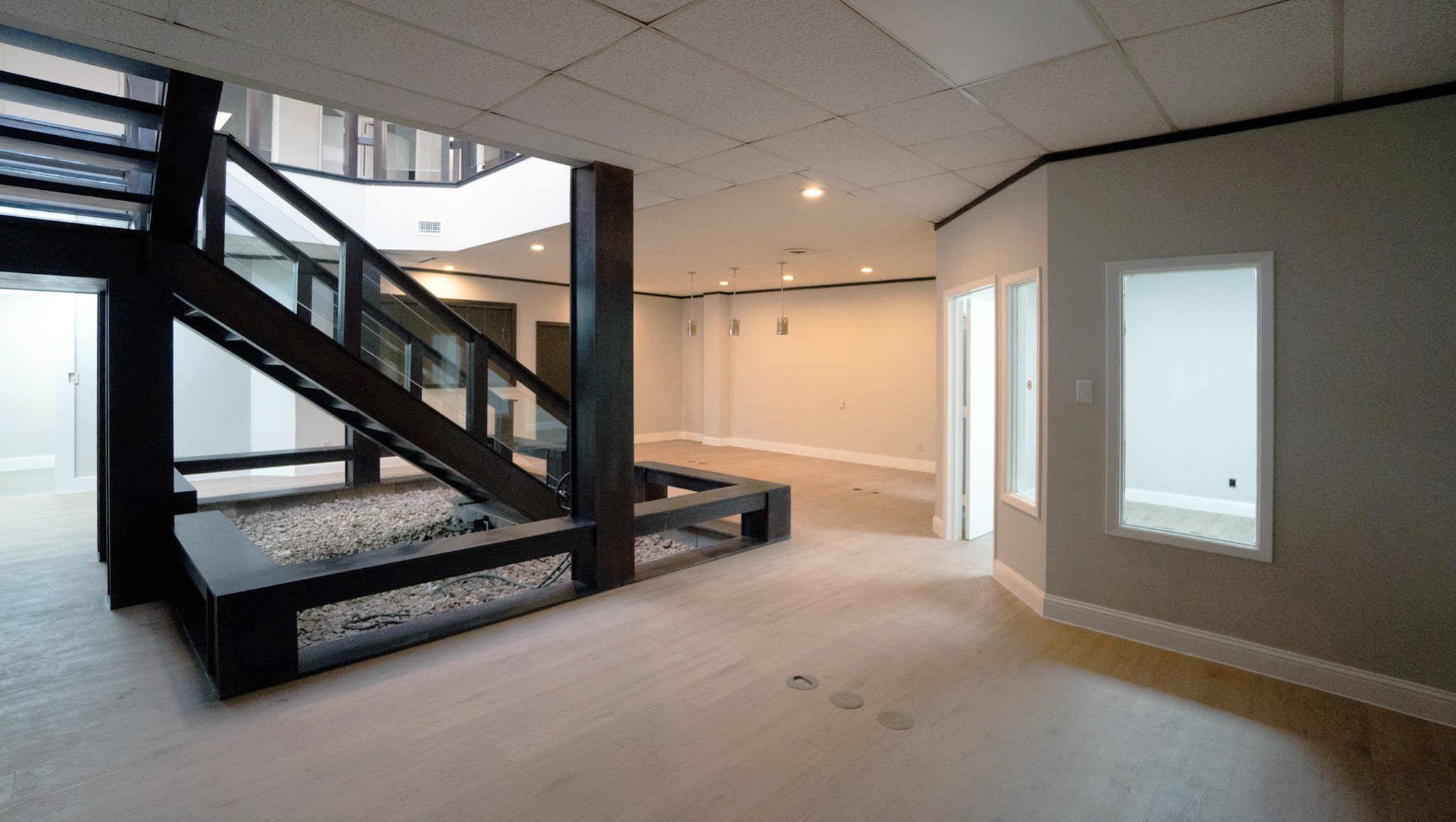 9220 Rasmus Drive Houston, TX 77063 - Photo 21 of 30 a view of an empty room with stairs