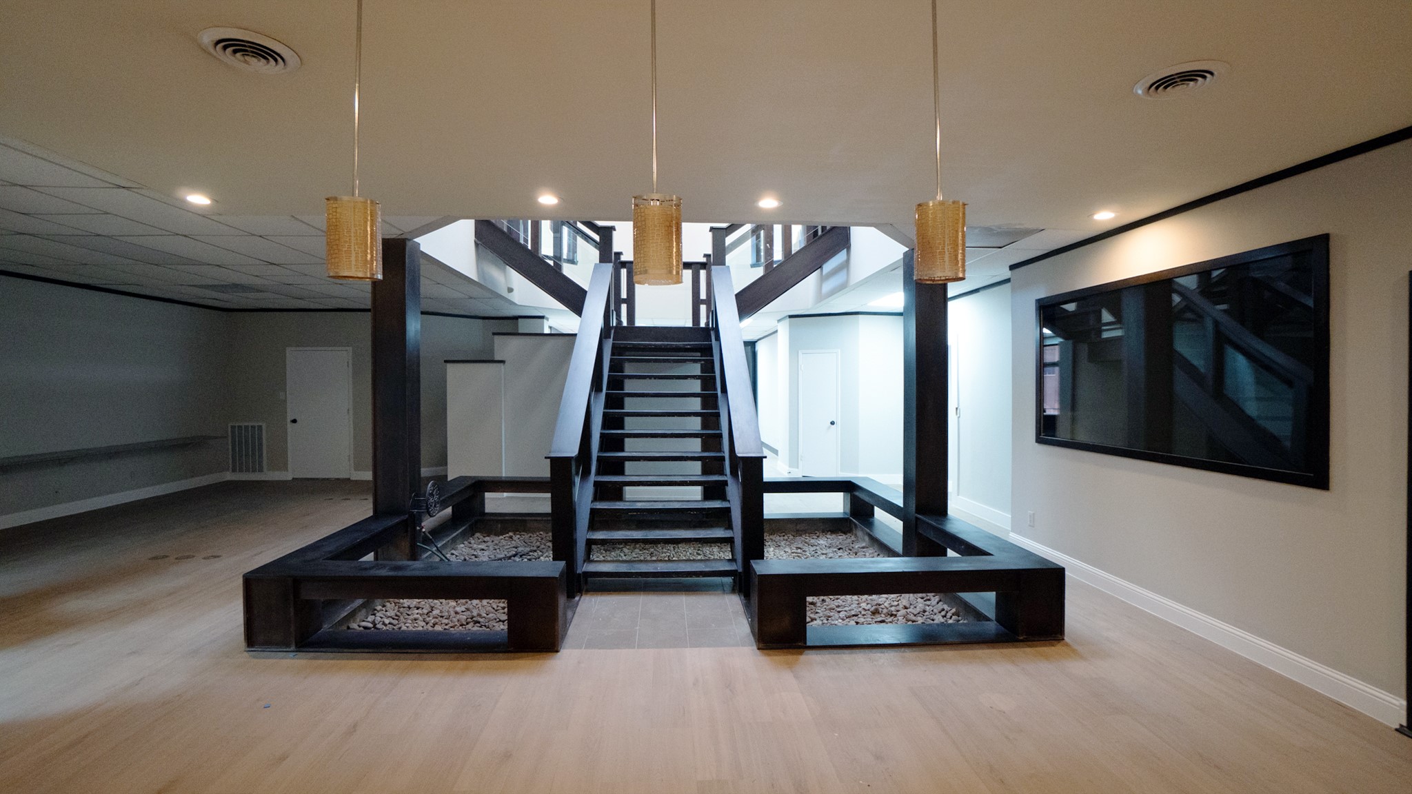 9220 Rasmus Drive Houston, TX 77063 - Photo 3 of 30 a living room with furniture a flat screen tv and a ceiling fan