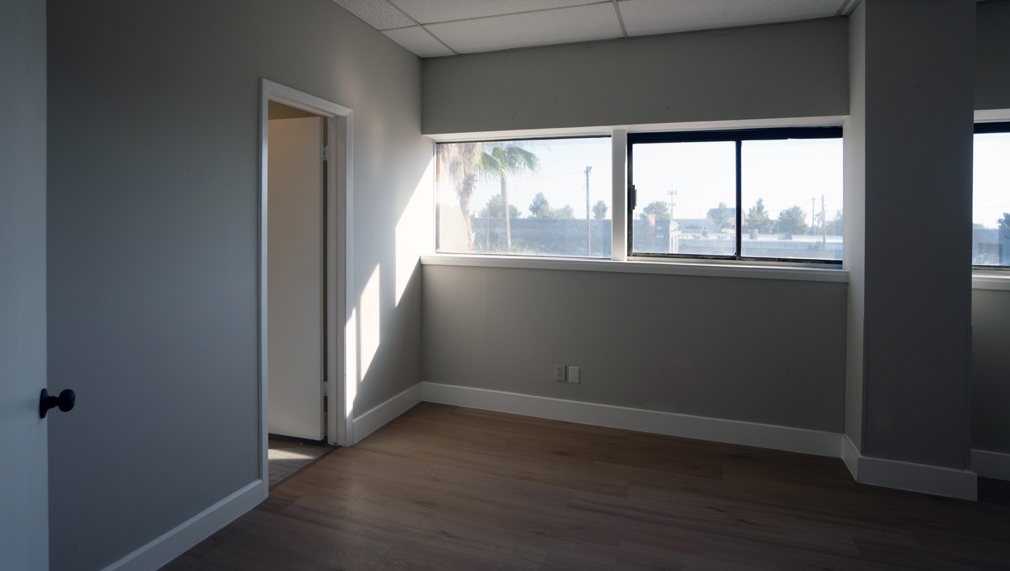 9220 Rasmus Drive Houston, TX 77063 - Photo 10 of 30 an empty room with wooden floor and windows