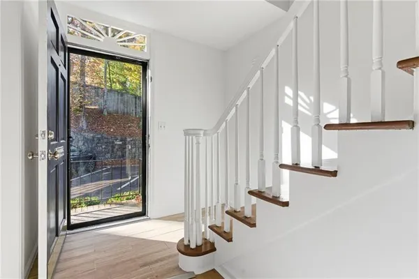 a view of front door with wooden floor