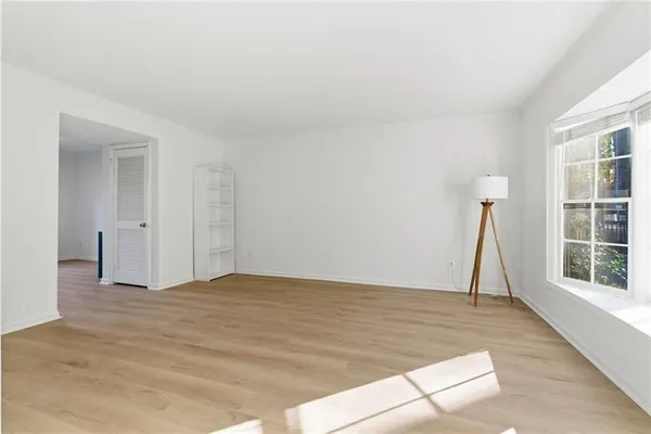 a view of empty room with windows