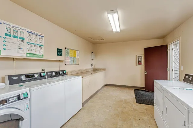 a view of a house with a wooden deck