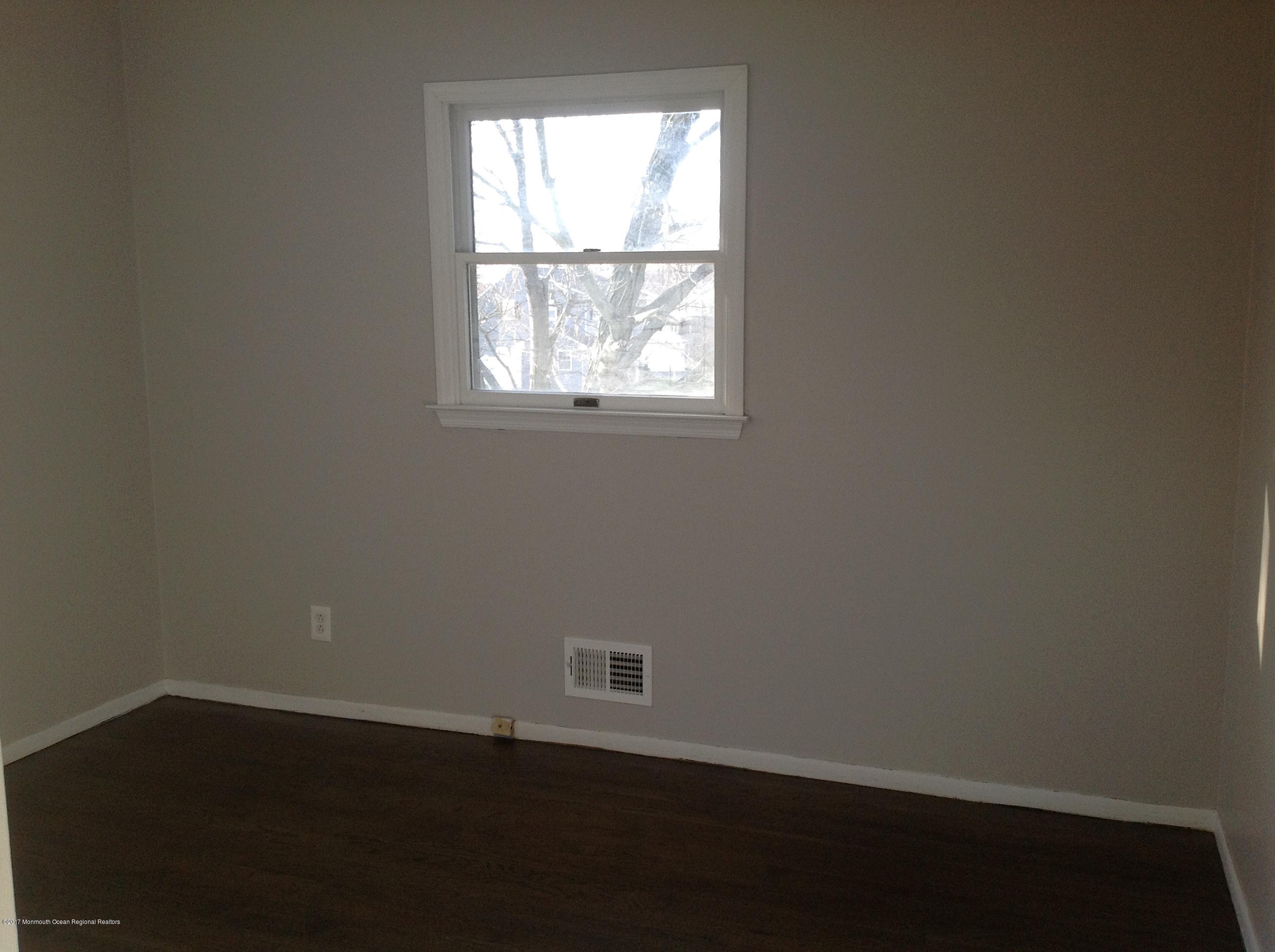 10 Carriage Road North Hazlet, NJ 07730 - Photo 12 of 24 an empty room with wooden floor and windows