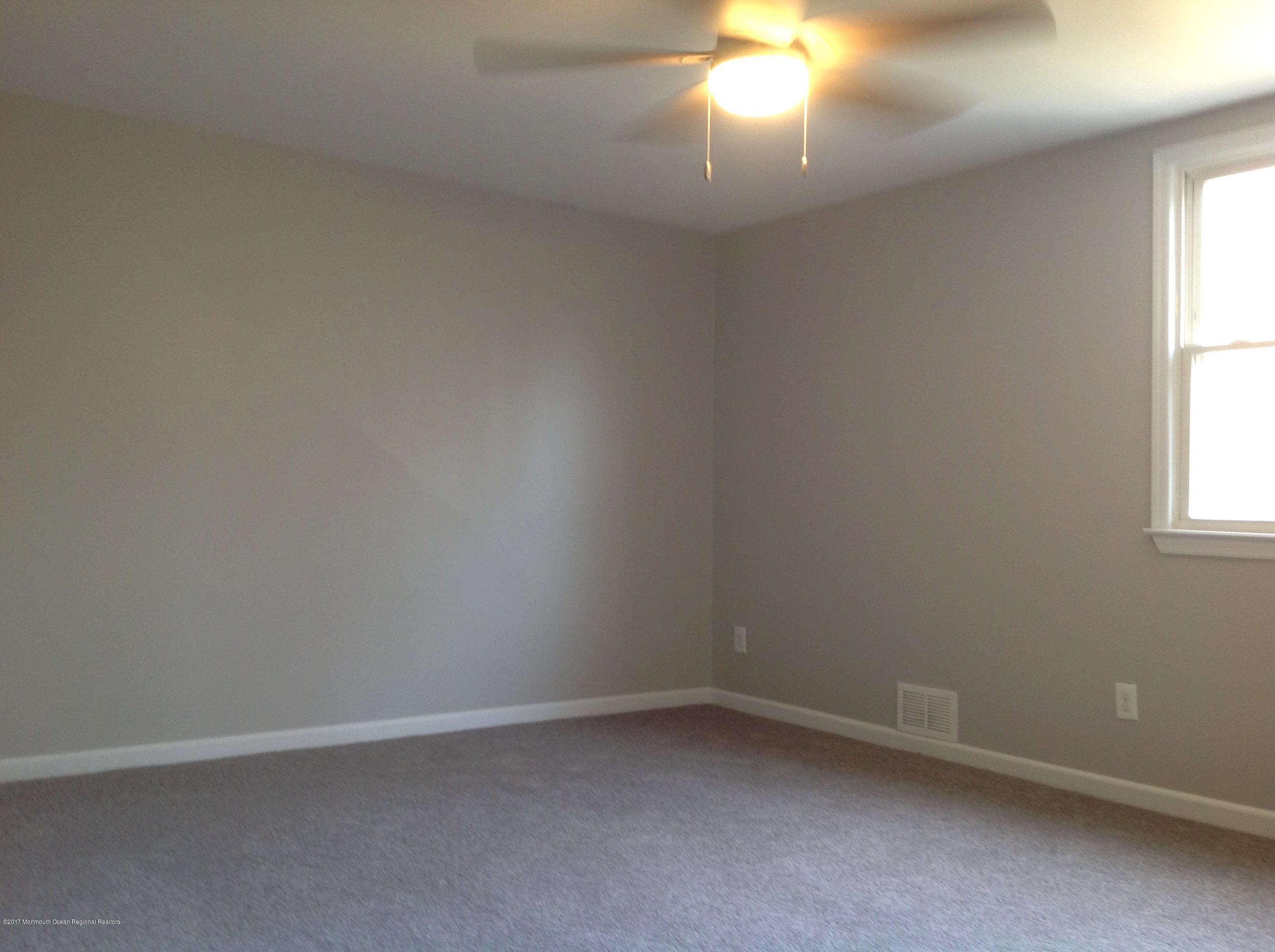10 Carriage Road North Hazlet, NJ 07730 - Photo 15 of 24 an empty room with a window