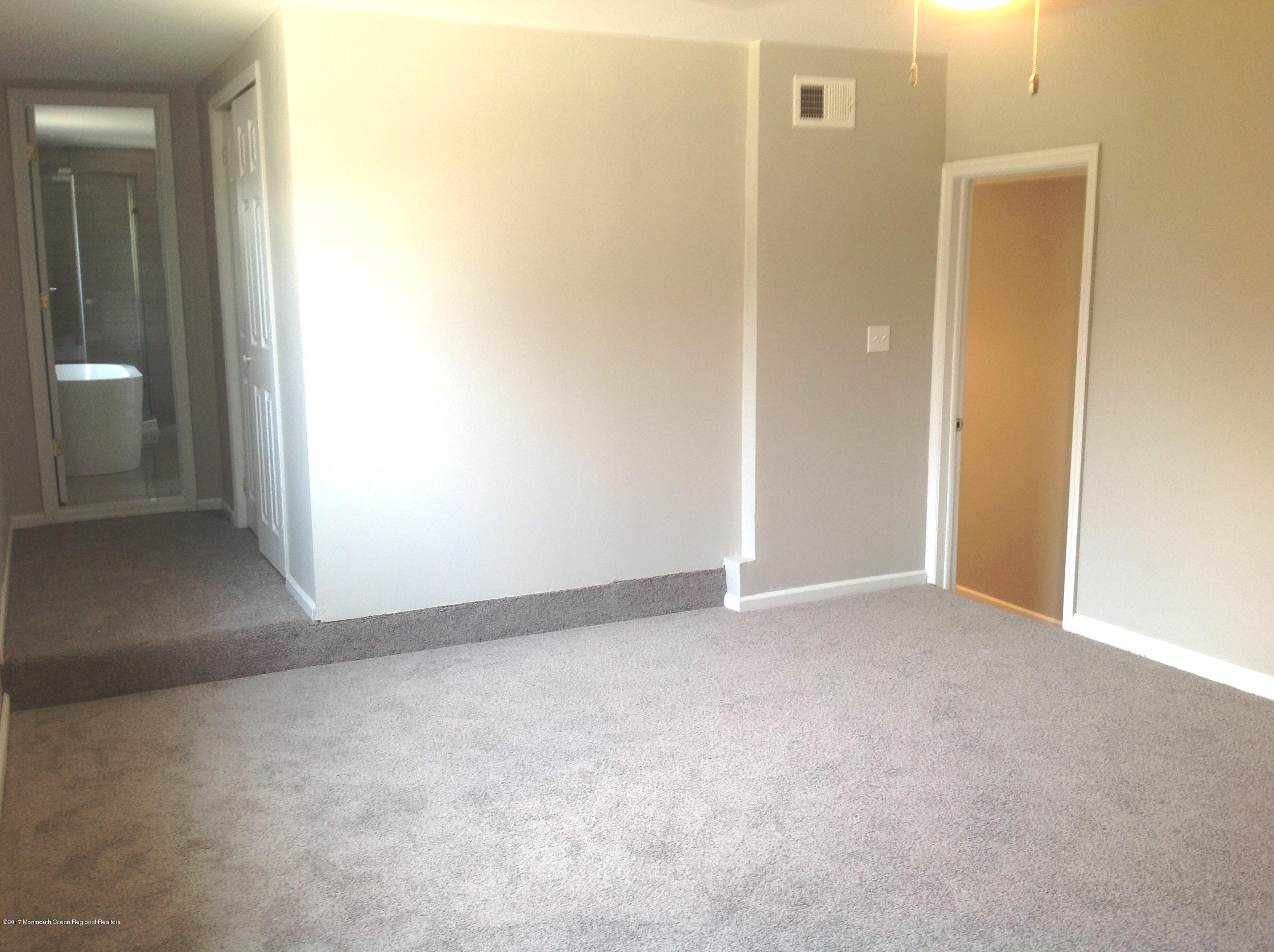 10 Carriage Road North Hazlet, NJ 07730 - Photo 16 of 24 a view of an empty room and a bathroom