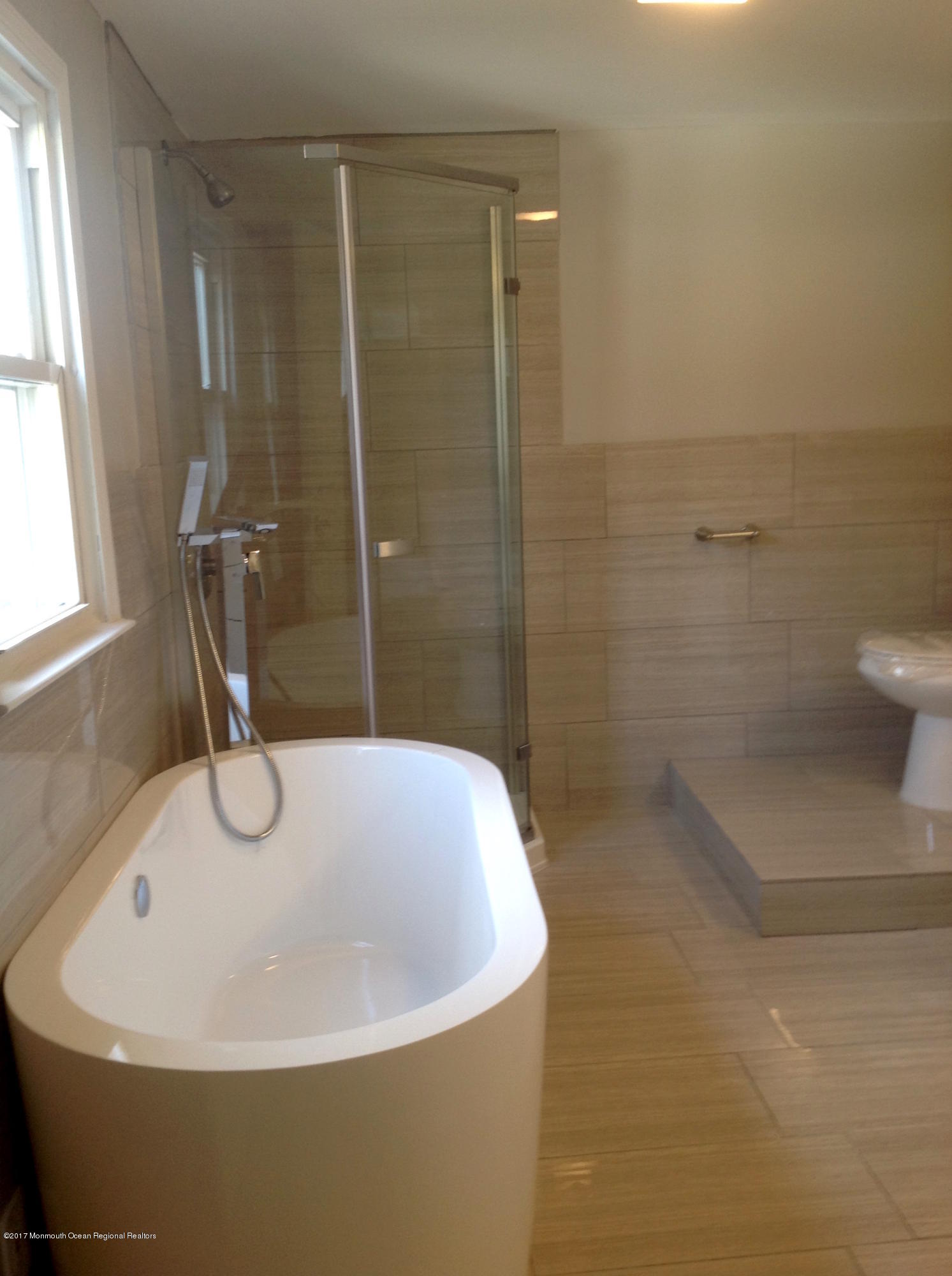 10 Carriage Road North Hazlet, NJ 07730 - Photo 17 of 24 a bathroom with a sink a toilet and shower