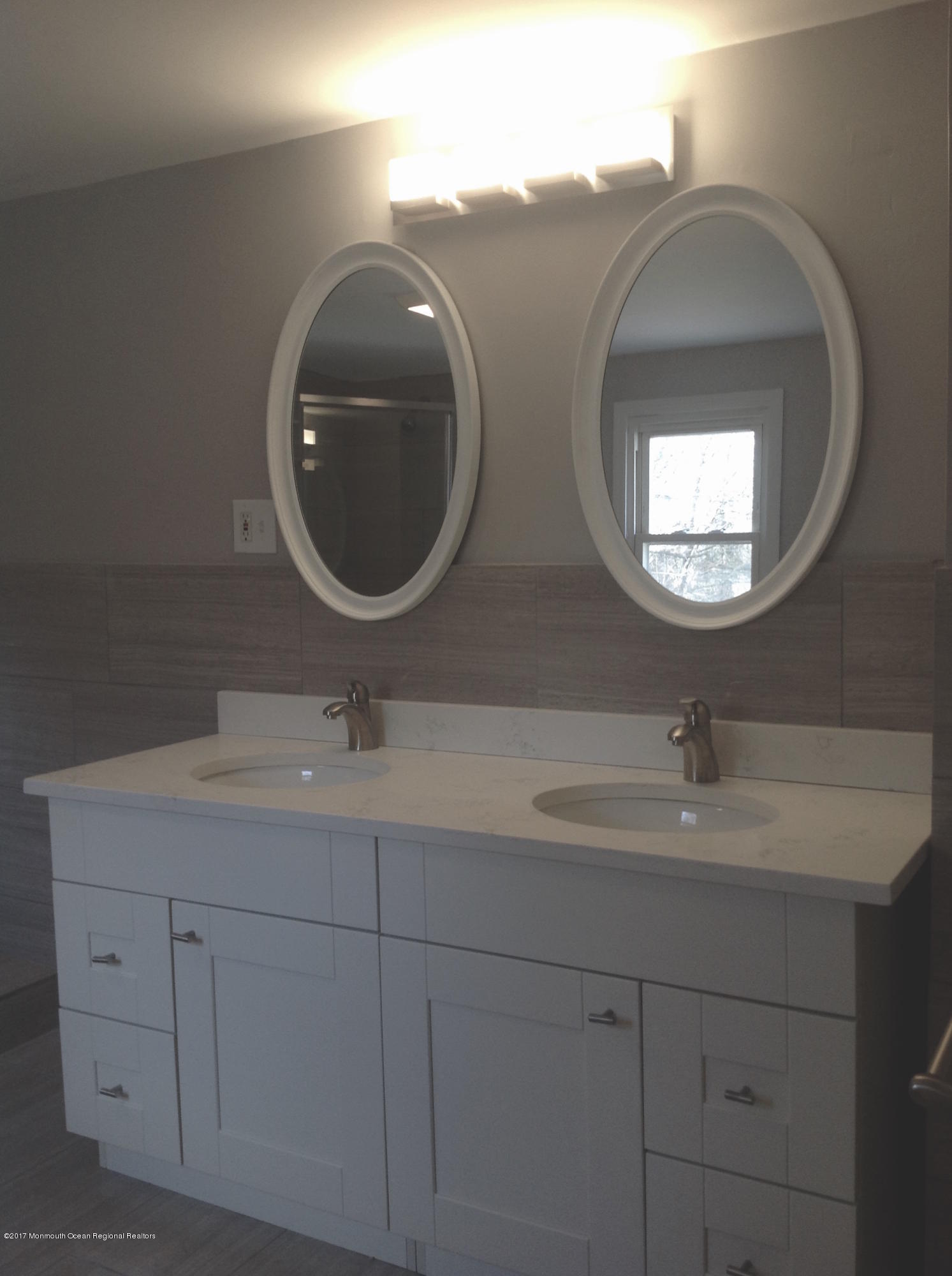 10 Carriage Road North Hazlet, NJ 07730 - Photo 18 of 24 a bathroom with 2 sink and a mirror