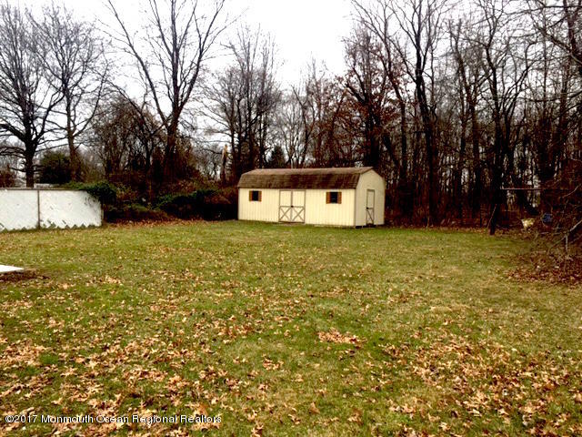 10 Carriage Road North Hazlet, NJ 07730 - Photo 24 of 24 a white house that has a tree in front of it