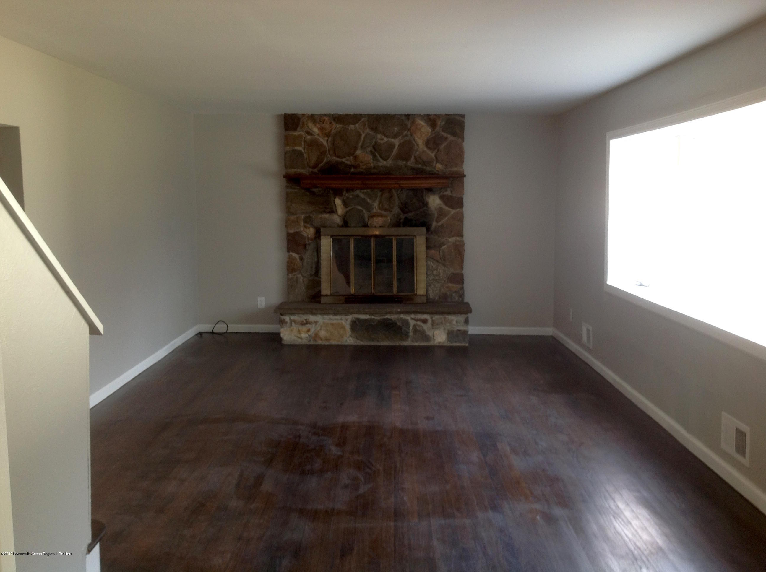 10 Carriage Road North Hazlet, NJ 07730 - Photo 4 of 24 a view of a fireplace in a room