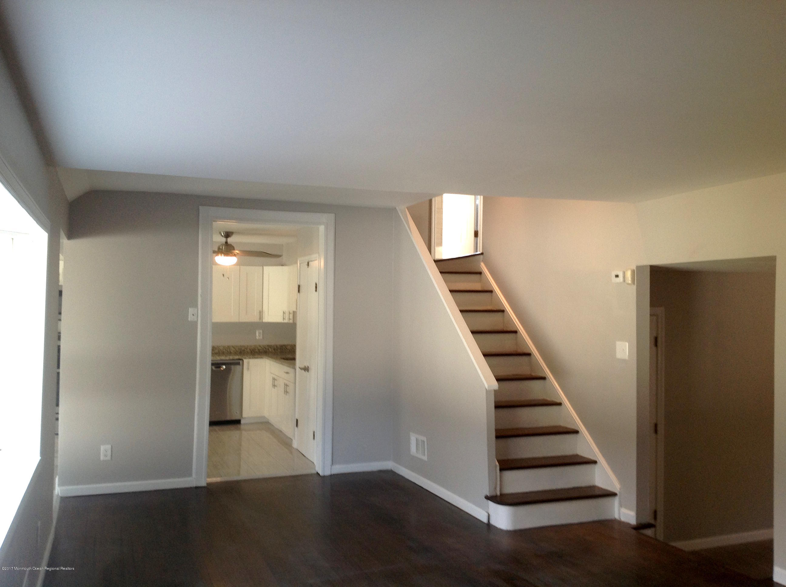 10 Carriage Road North Hazlet, NJ 07730 - Photo 5 of 24 a view of entryway and hall with wooden floor
