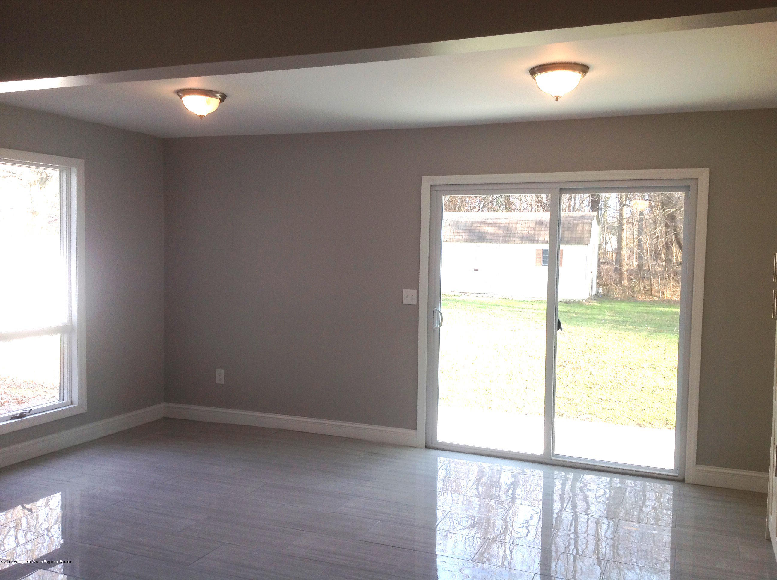 10 Carriage Road North Hazlet, NJ 07730 - Photo 8 of 24 a view of an empty room and a window