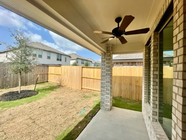 a view of a backyard of the house