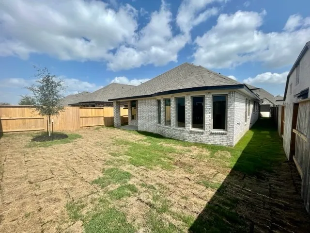 a house view with a backyard space