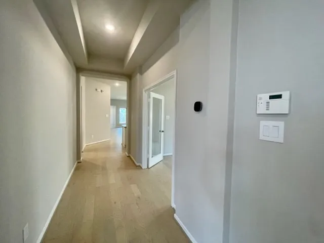 a bathroom with a shower and a sink