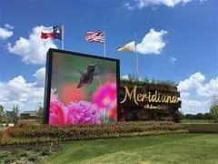 a view of swimming pool with a table and chairs
