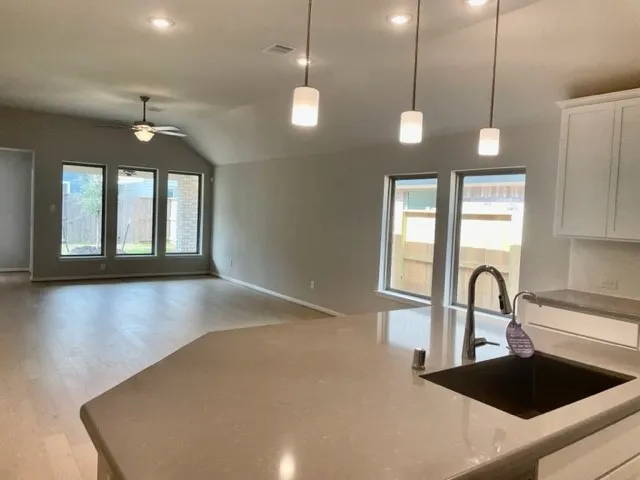 a view of a sink and a window in a room