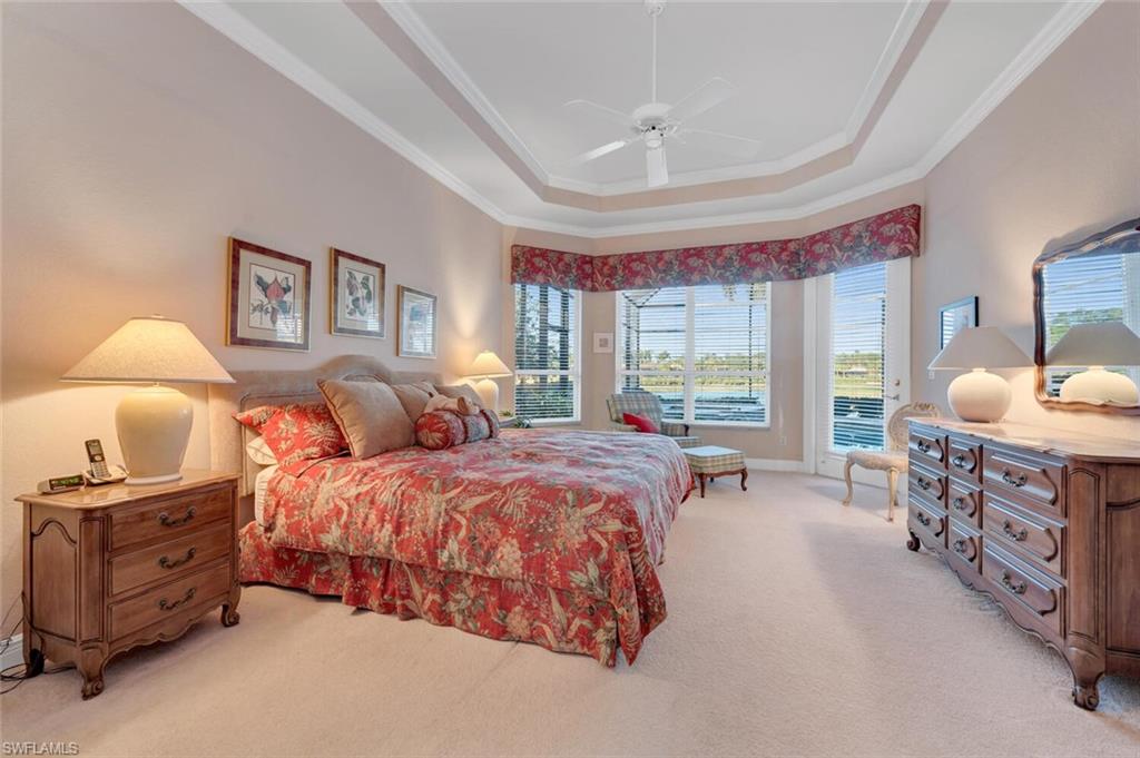 5044 Castlerock Way Naples, FL 34112 - Photo 11 of 38 a spacious bedroom with two beds and large windows