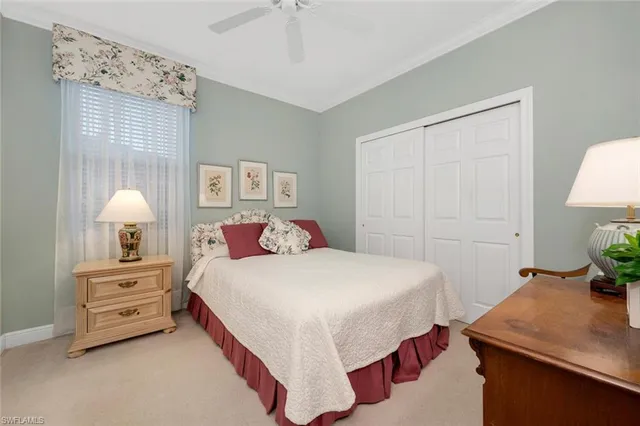 a bedroom with a bed and a table in it