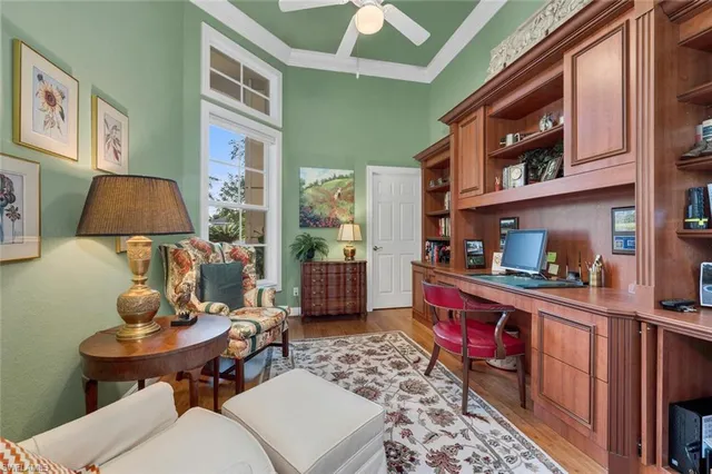 a living room with furniture a rug and a window