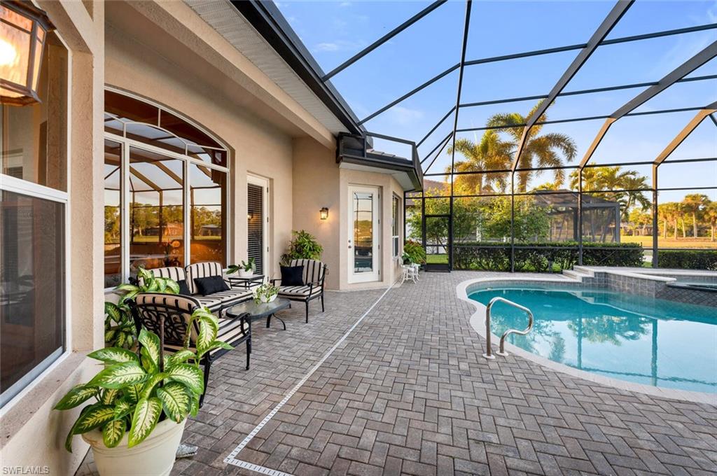 5044 Castlerock Way Naples, FL 34112 - Photo 19 of 38 a building outdoor space with patio furniture and potted plants