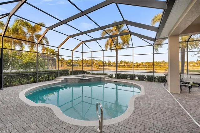 a view of a swimming pool with a porch