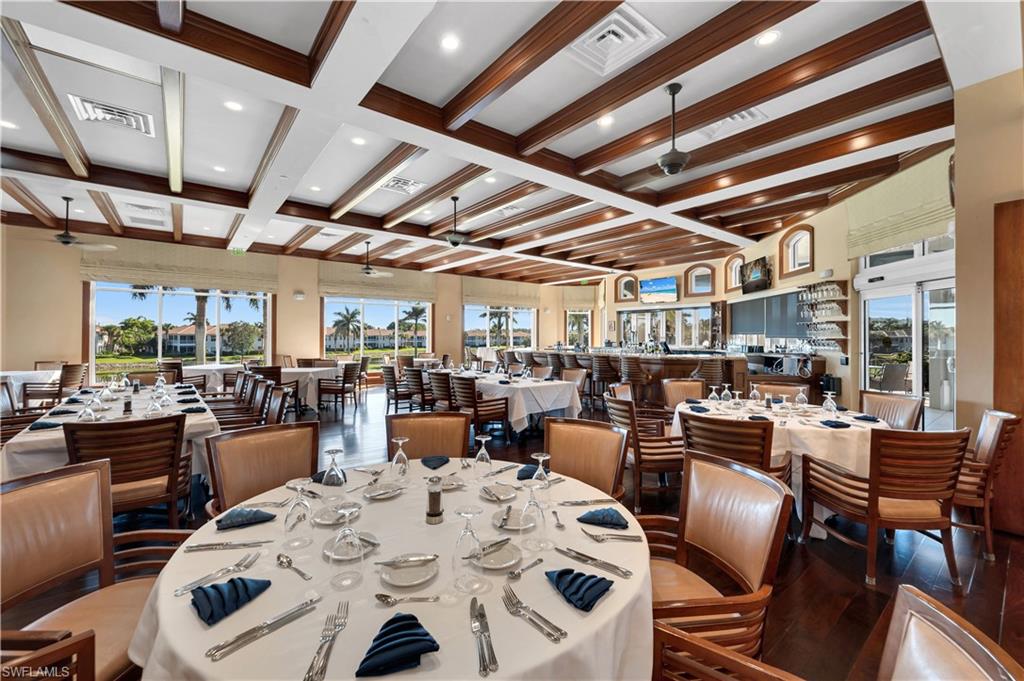 5044 Castlerock Way Naples, FL 34112 - Photo 27 of 38 a view of a dining room with furniture window and outside view