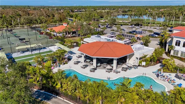 an aerial view of a house with a swimming pool