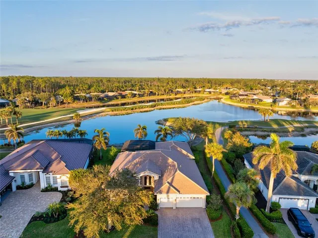 an aerial view of a house with a ocean view