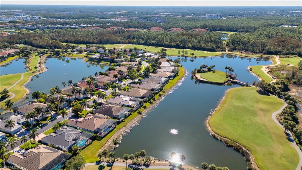 5044 Castlerock Way Naples, FL 34112 - Photo 34 of 38 an aerial view of residential houses with outdoor space