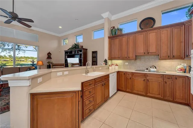 a kitchen with stainless steel appliances granite countertop a sink and cabinets