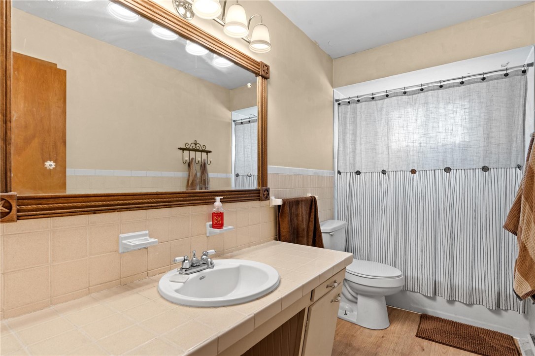 4150 Rose Marie Road Franklin, OH 45005 - Photo 27 of 36 Functional full bathroom with a spacious vanity, large mirror, and tiled floors.