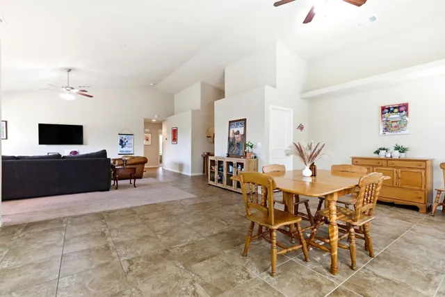 a kitchen with a sink a counter top space and stainless steel appliances