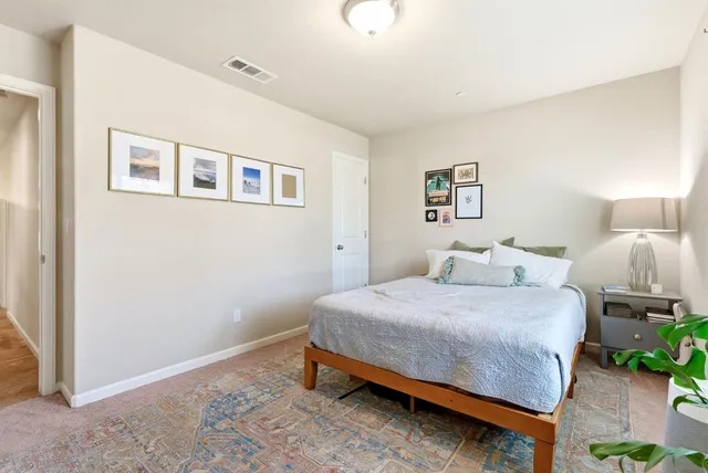 a view of a livingroom with workspace and a window
